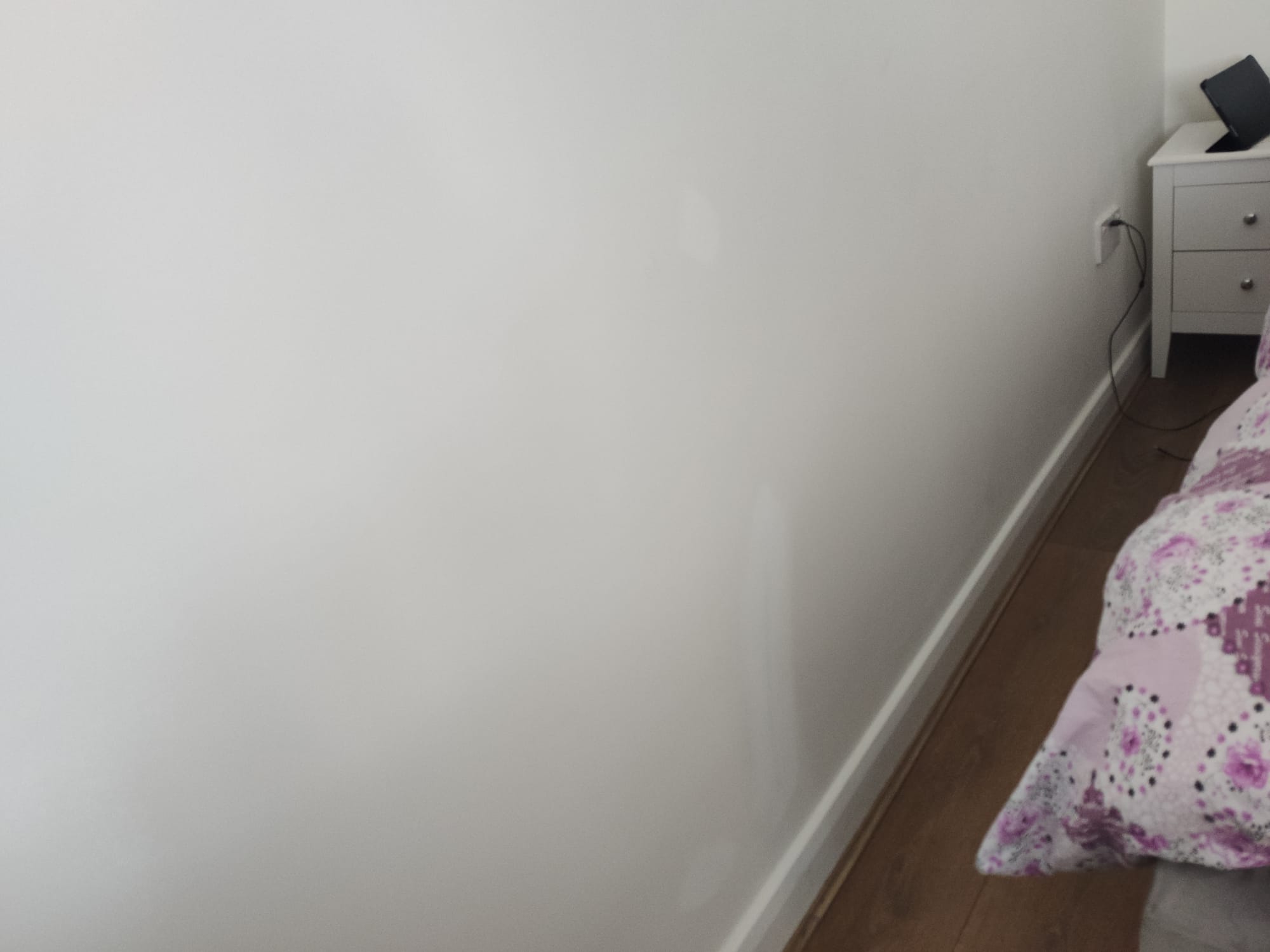 Bedroom wall paint which was damaged by him when moving the furnitures around for installing new floow laminates